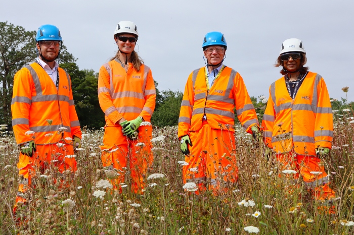 Cllr Stephen Giles-Medhurst standing in the rewilded grassland with HS2 and Align officials