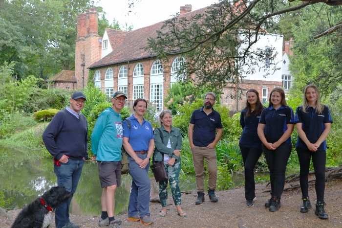 Councillors and officers gathered by The Bury Manor House