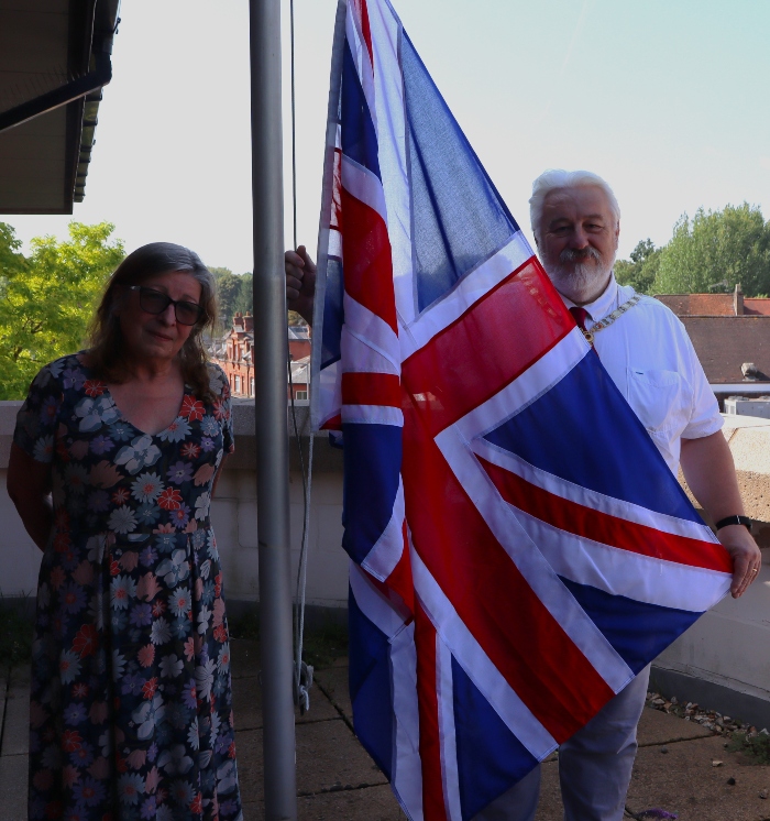 Deputy Council Leader, Cllr Sarah Nelmes, and Chair of the Council, Cllr Stephen King, with the Union Flag