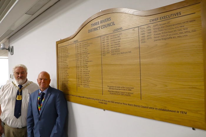 (From left) Cllr Stephen King, Chair of the council, and Cllr Stephen Giles-Medhurst, Leader of the council, standing next to the the oak wooden honours board that commemorates the past and present leader, chairs and chief executives of Three Rivers District Council.