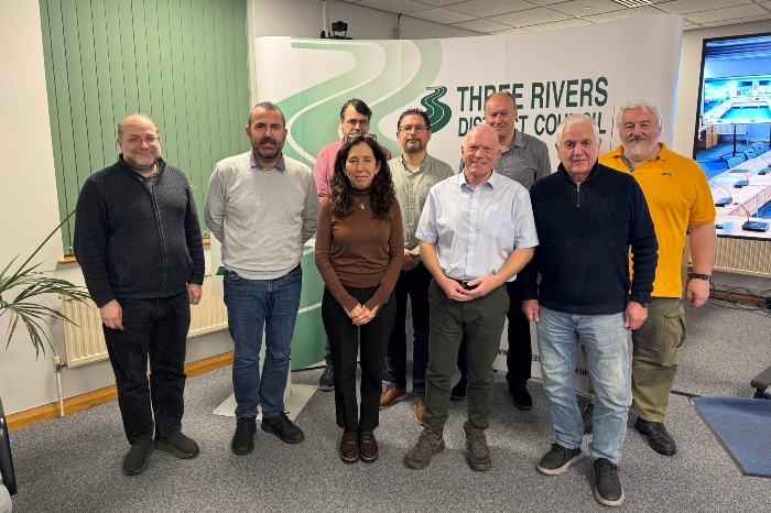 The parish and community representatives standing in front of the TRDC banner with council leader Cllr Stephen Giles-Medhurst