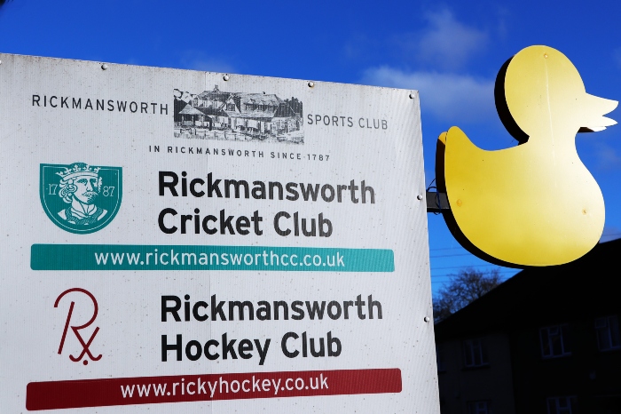 The Rickmansworth Cricket Club sign with a yellow duck sign attached to it.