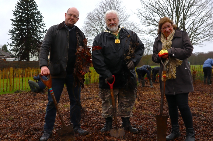 Cllrs Jon Tankard, Stephen King and Sarah Nelmes holding tree saplings and shovels