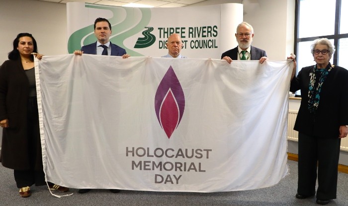 Councillors holding the Holocaust Memorial Day Flag