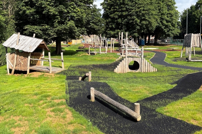 New play equipment with freshly tarmaced pavement